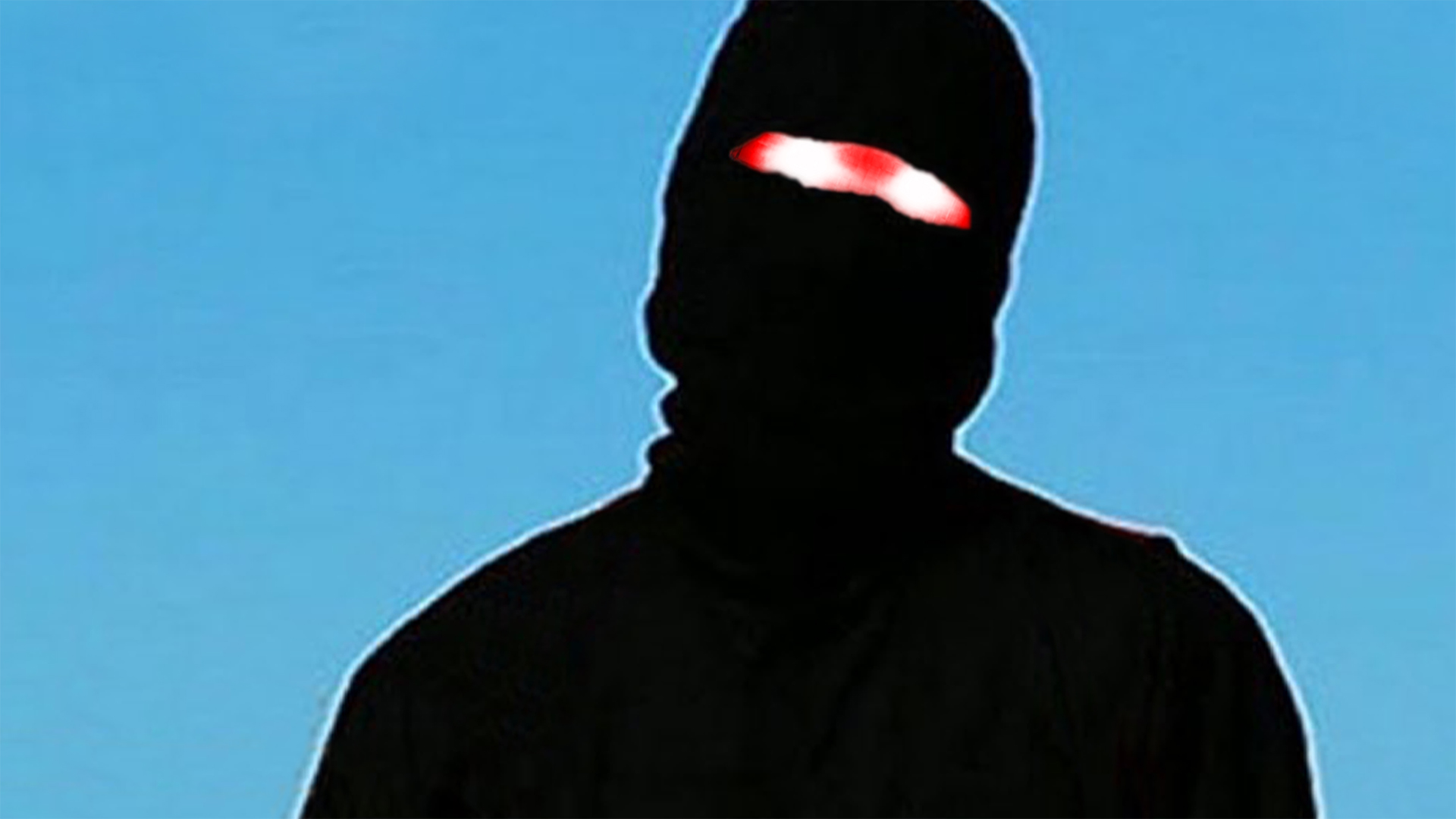 Kuvassa mustaan pukeutunut hahmo, jolla kasvot peittävä päähine,