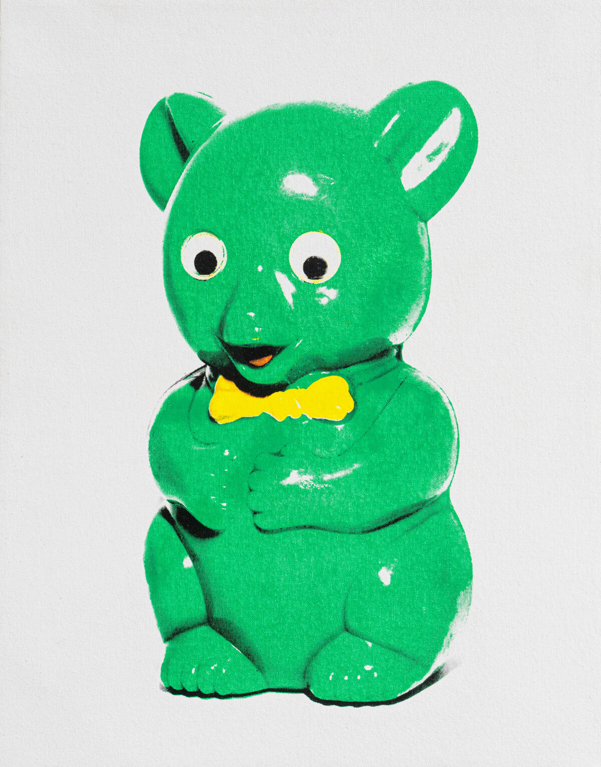 A print of a green, shiny toy character.